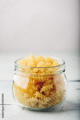 Jar of Italian whole wheat fusilli pasta photo