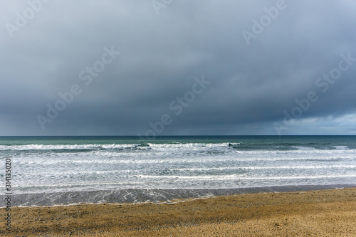 Schilderij op canvas stormy clouds and waves at Widemouth Bay , Bude in Cornwall