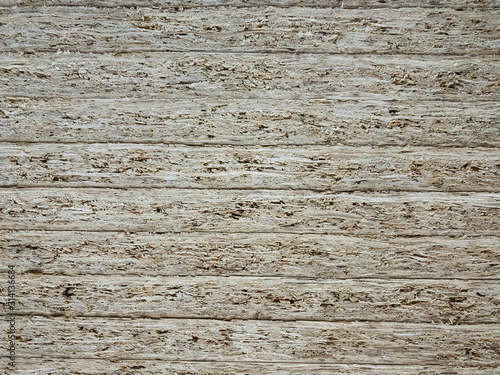 Fototapeta Naklejka Na Ścianę i Meble -  Texture of a wood wall. OSB boards are made of brown wood chips sanded into a wooden background. Repair in the house. Recycled wood. Quality work. osb 4k stock footage 
