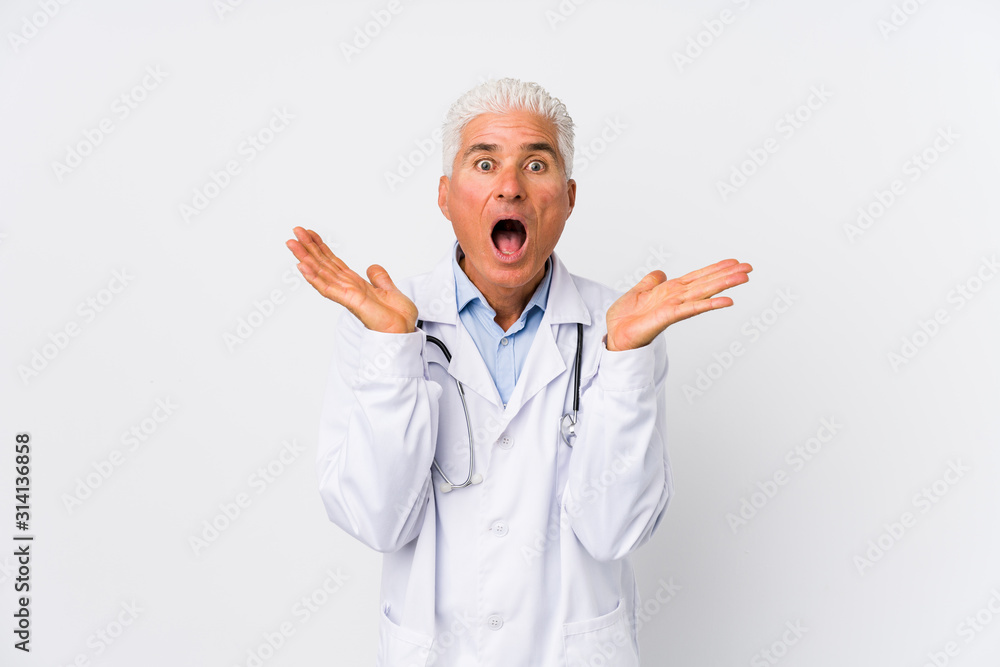 Mature caucasian doctor man surprised and shocked. Mature caucasian doctor man surprised and shocked.