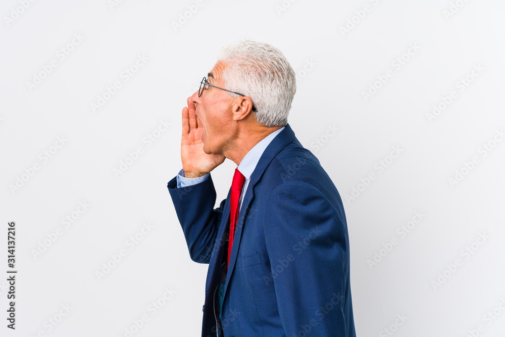 Middle aged caucasian business man isolated shouting and holding palm near opened mouth. Middle aged caucasian business man isolated shouting and holding palm near opened mouth.