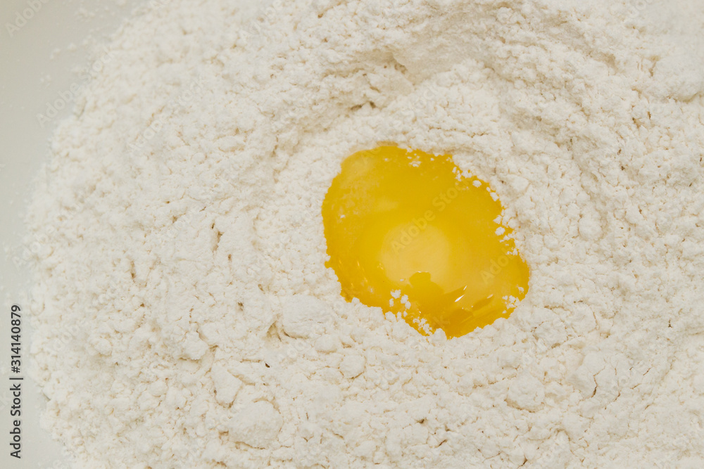 Cooking dough in a white plastic bowl at home Cooking dough in a white plastic bowl at home