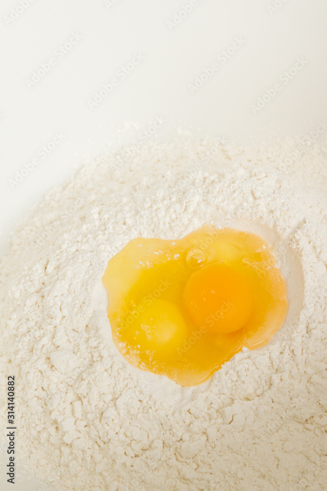 Cooking dough in a white plastic bowl at home Cooking dough in a white plastic bowl at home