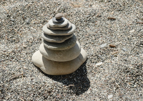 Photography pyramid of stones on a sandy beach