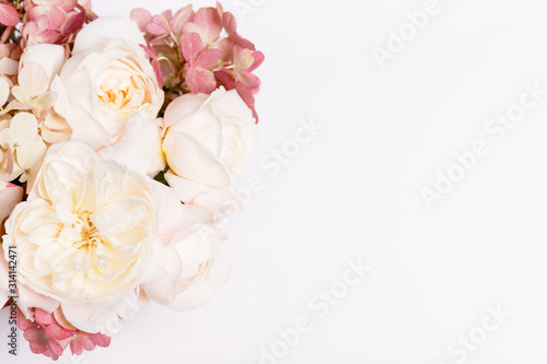 Autumn bouquet of flowers in red, burgundy colors. Roses, hydrangea. Flower composition on white background.