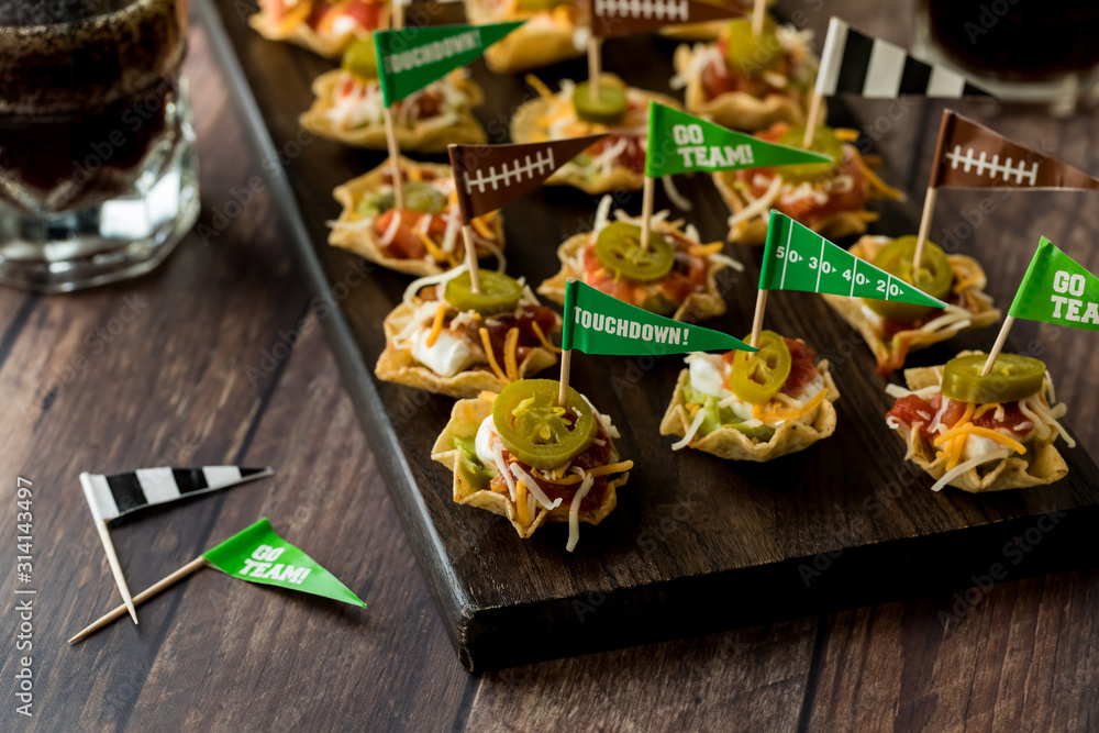 Platter of mexican layered dip appetizers. Platter of mexican layered dip appetizers.