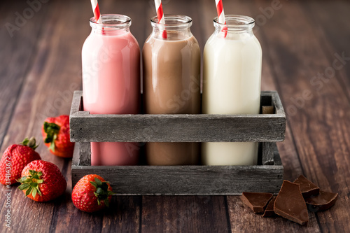 Three bottles of flavoured milk.