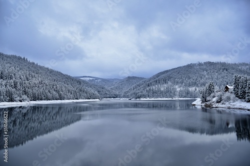 winter landscape with lake and mountains in winter