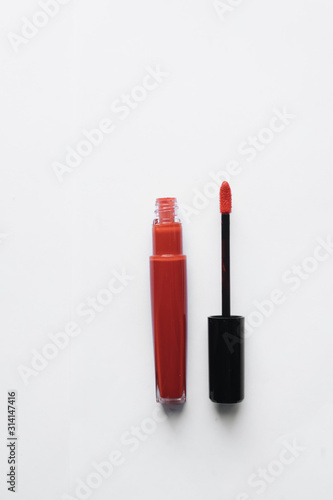 Red lipstick on white background 