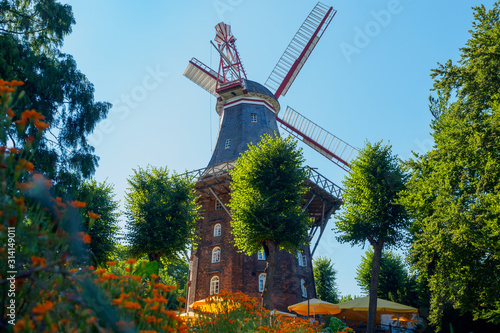 Windmill near a river in Bremen, Germany photo