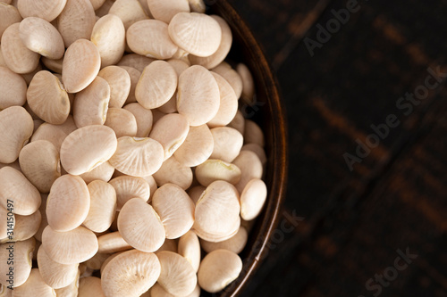 Bowl of Baby Lima Beans or Butter Beans on a Rustic Wooden Table photo