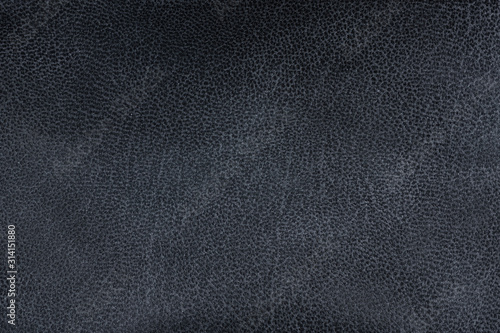 Closeup textured grey black leather background, big grain