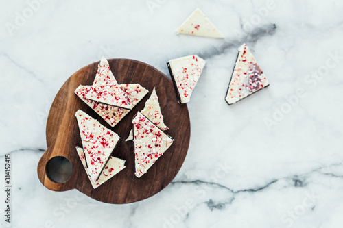 Peppermint white chocolate bark on marble background