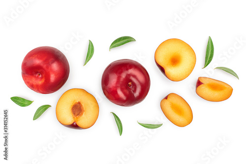 fresh red plum and half with leaves isolated on white background with copy space for your text. Top view. Flat lay