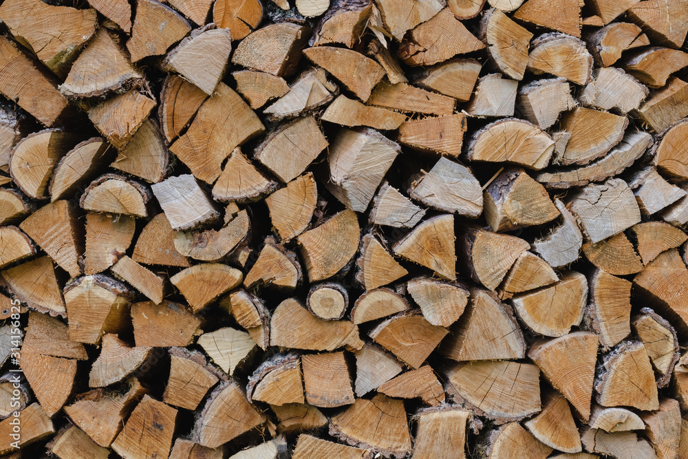 Firewood stacked. Firewood pattern background texture. Firewood stacked. Firewood pattern background texture.