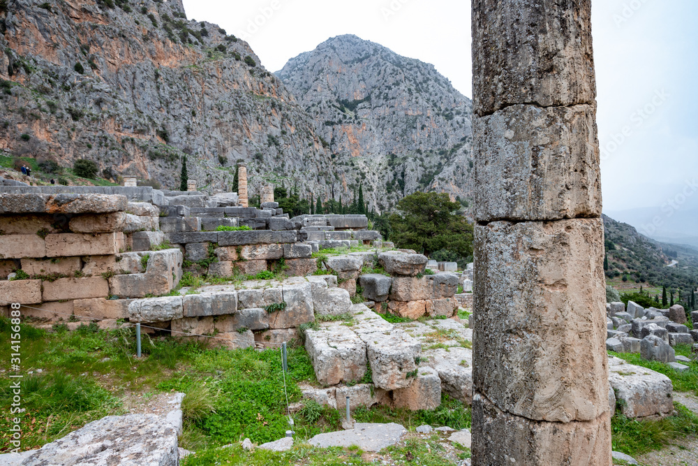 Ruins of the ancient temple of Apollo, archaeological site of Delphi along the slope of Mount Parnassus, UNESCO World Heritage, Greece.