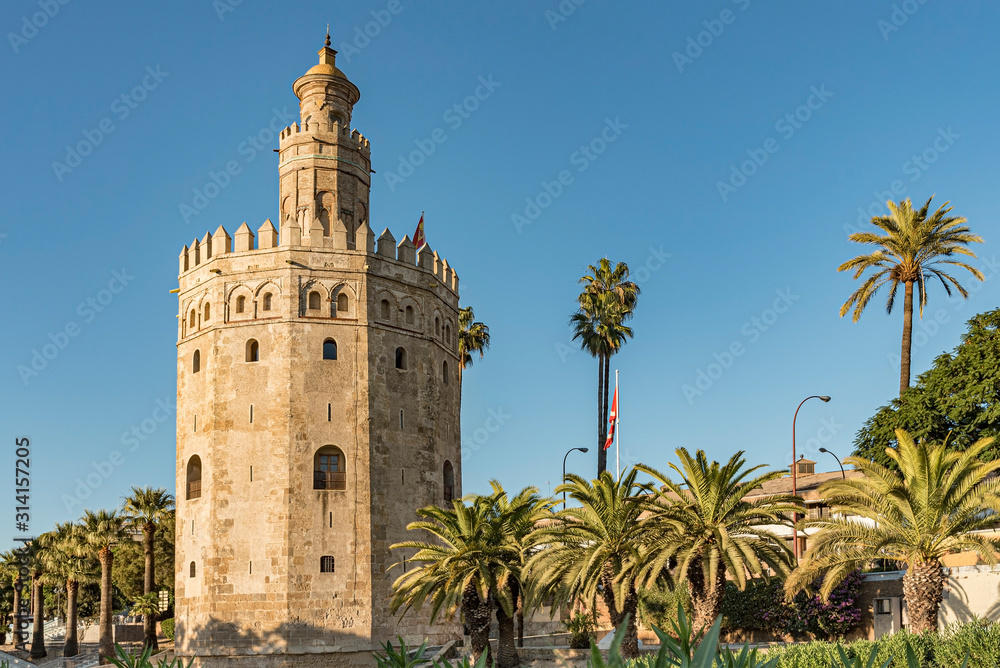 View of Golden Tower in Seville, Andalusia, Spain. Used as a military Moorish watchtower along the Guadalquivir river