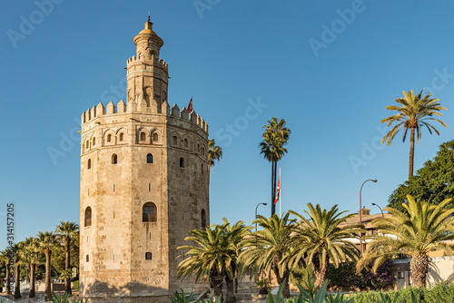 View of Golden Tower in Seville, Andalusia, Spain. Used as a military Moorish watchtower along the Guadalquivir river