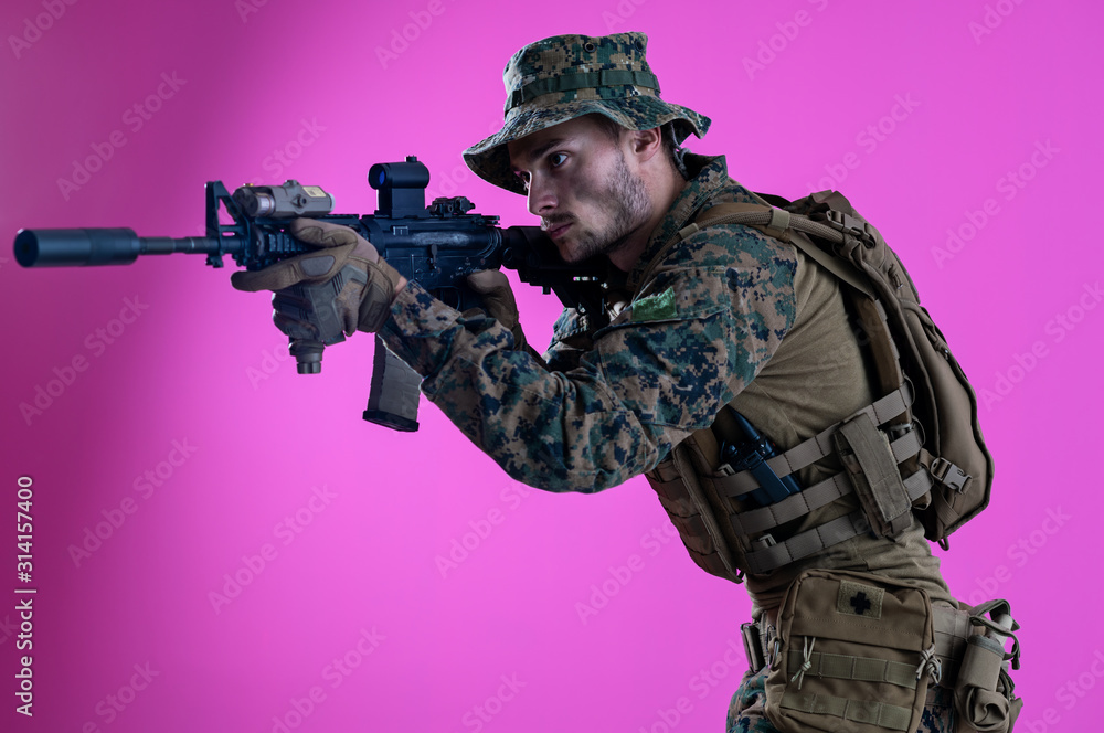 soldier in action aiming laseer sight optics pink background soldier in action aiming laseer sight optics pink background