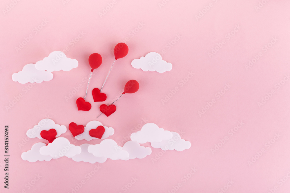 Valentine's day background. Red hearts, baloons and clouds on soft pink background feel like fluffy in the air