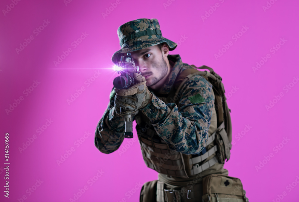 soldier in action aiming laseer sight optics pink background soldier in action aiming laseer sight optics pink background