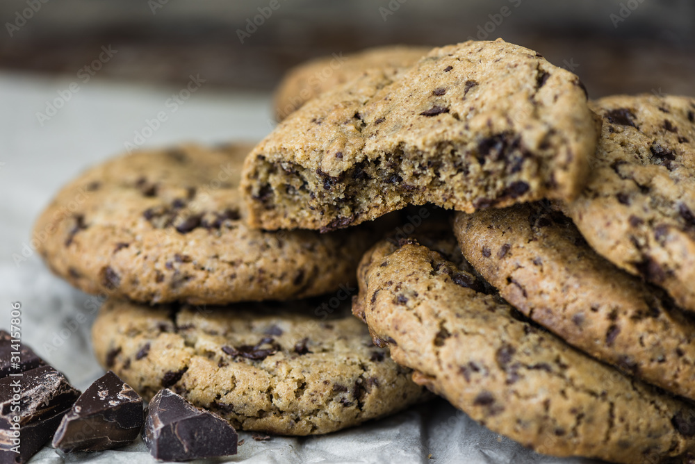 Freshly Baked Chocolate Cookies on Baking Paper. Sweet Biscuits. Homemade pastry. Freshly Baked Chocolate Cookies on Baking Paper. Sweet Biscuits. Homemade pastry.