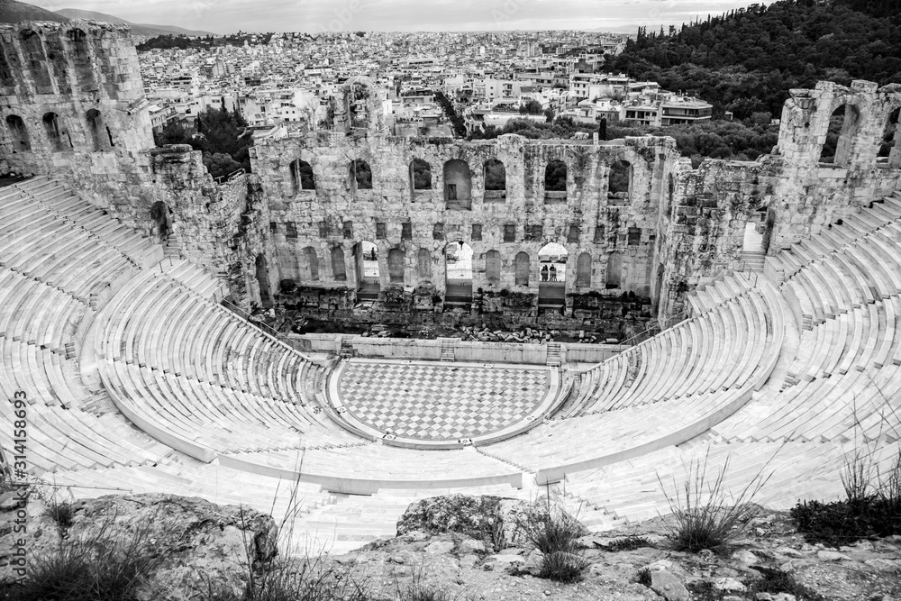 black and white photo of the Herodeion, Herodion, the Odeon of Herodes Atticus a stone Roman theater in Athens, Greece