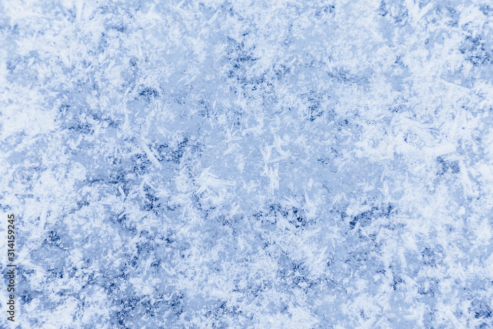 Ice texture, interesting frozen lake patterns, naturally created forms. Frozen river's water in the winter in mount Vitosha, near Sofia, Bulgaria. Ice Age climate changes.