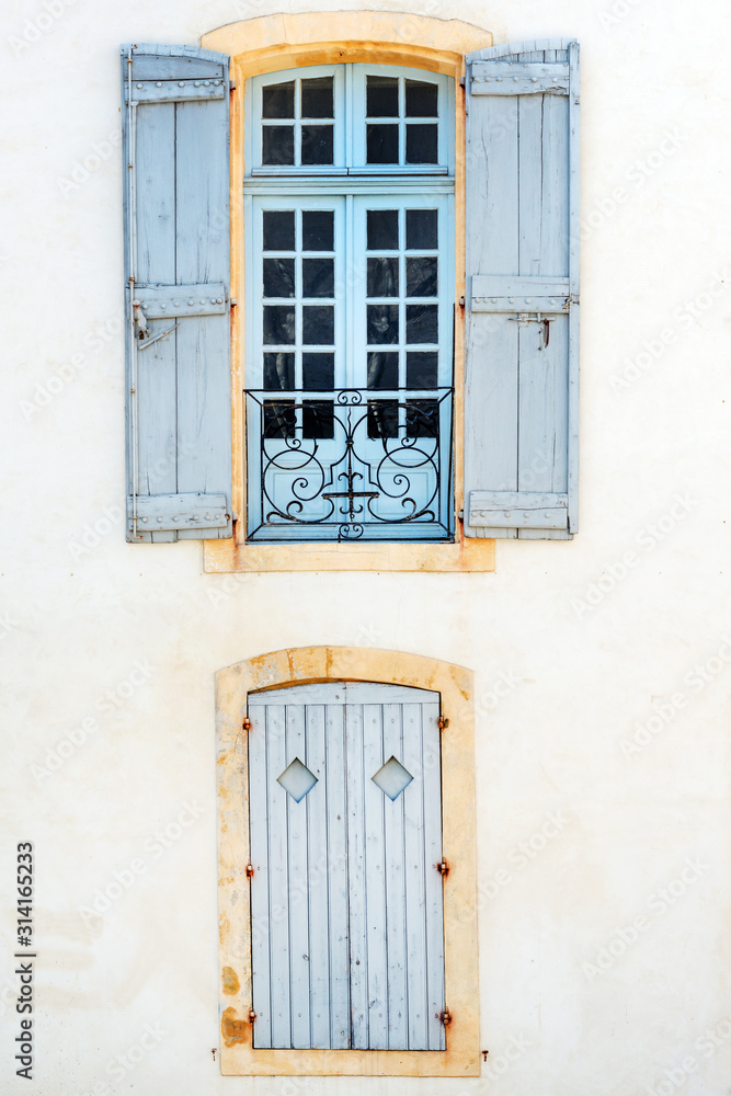 Picturesque windows with shutters in historic center of Avignon, Provence