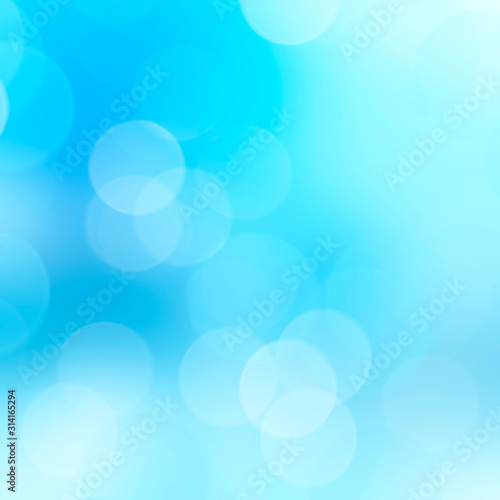 Blue bokeh lights abstract background. Bokeh on the background blurred the natural blue and white.