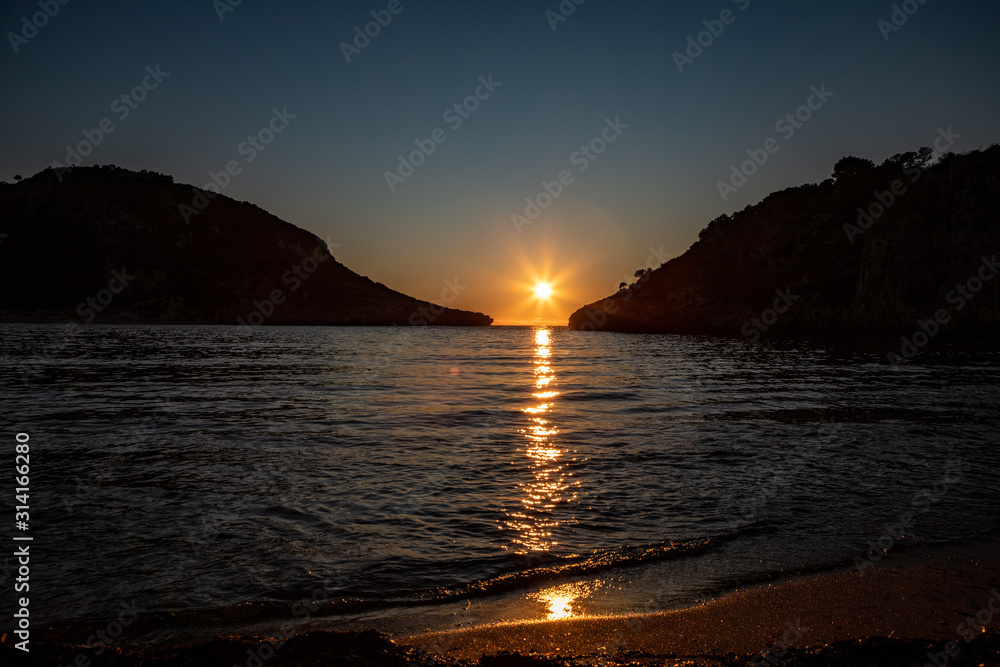 sunset on Voidokilia Beach a beautiful beach near Gialova Lagoon on Mediterranean sea. Pylos-Nestor, Messenia, Peloponnese, Greece