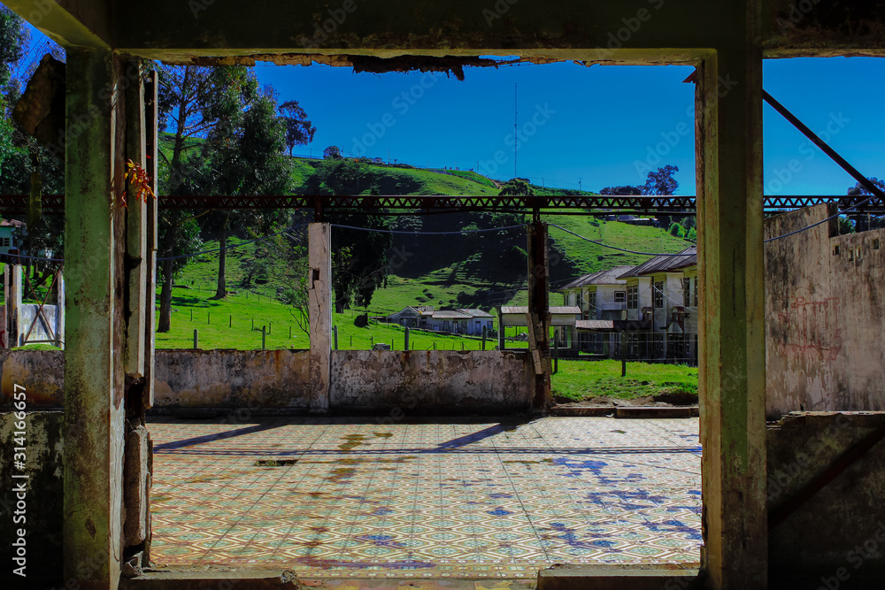 Fototapeta premium Old and ruin room with the mountains in back. Part of 