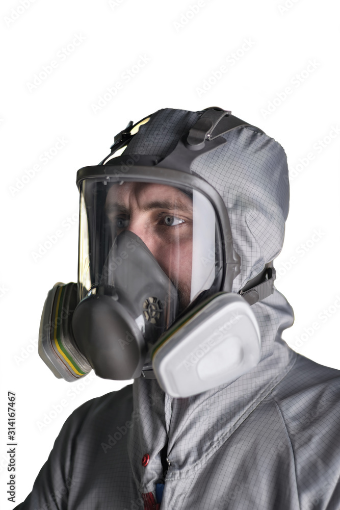Paint shop worker in overalls and protective mask on an isolated background Paint shop worker in overalls and protective mask on an isolated background