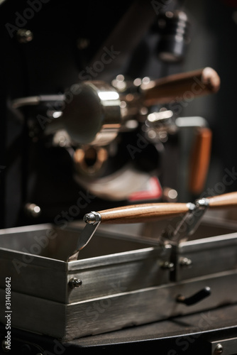 Coffee processing technology. Various details of coffee roasting machine. Close-up.
