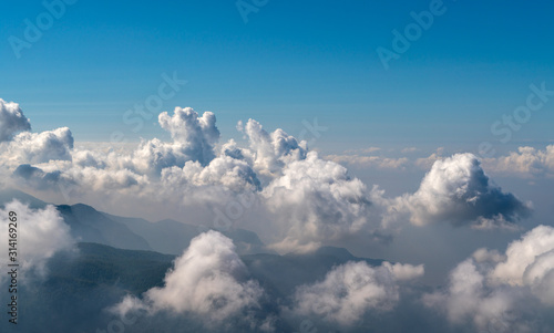 Beautiful Cloudscape. Aerial view of clouds and sky. Bird eye view from airplane window. Clouds panorama from airplane. High resolution photo