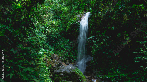Pretty Panacam waterfall surrounded a lot of green forest