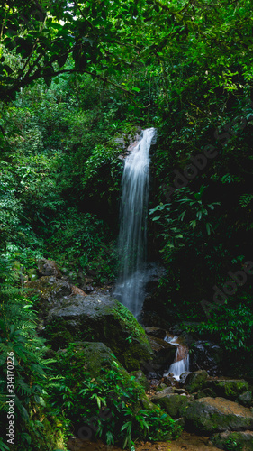 Pretty Panacam waterfall surrounded a lot of green forest