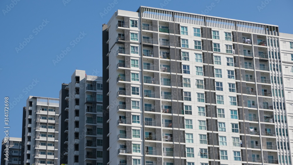 Modern building soar into blue sky Modern building soar into blue sky