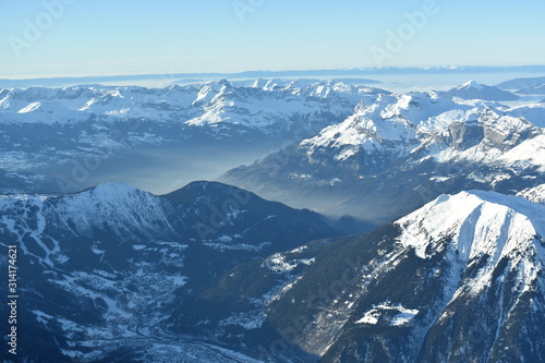 Snowy mountains, foggy valley