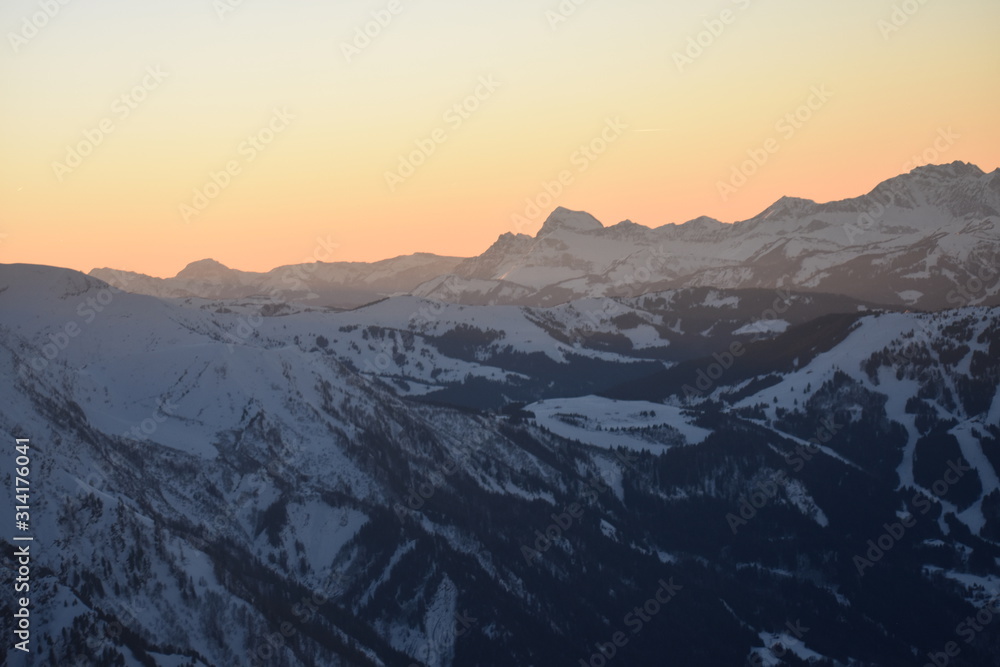 Snowy mountain sunset scene