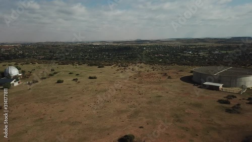 4K summer day aerial video Bloemfontein Naval Hill Planetarium Boyden Observatory, White Horse sculpture of Anglo Boer War days. Hill forms part of Franklin Game Reserve in Free State, South Africa photo