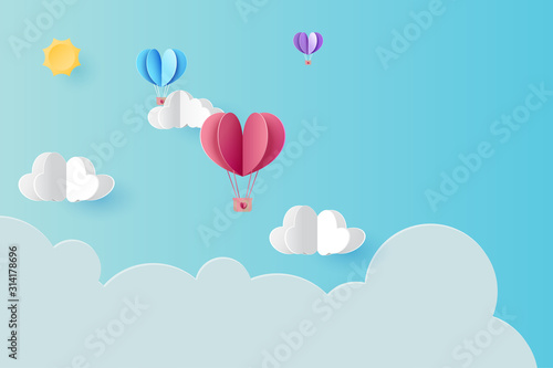 Love concept with hot air balloons floating on blue sky background.