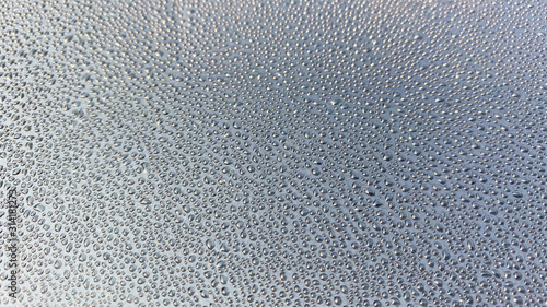 Water drop on the window mirror. Rain​ drops​ on​ glass​ background.