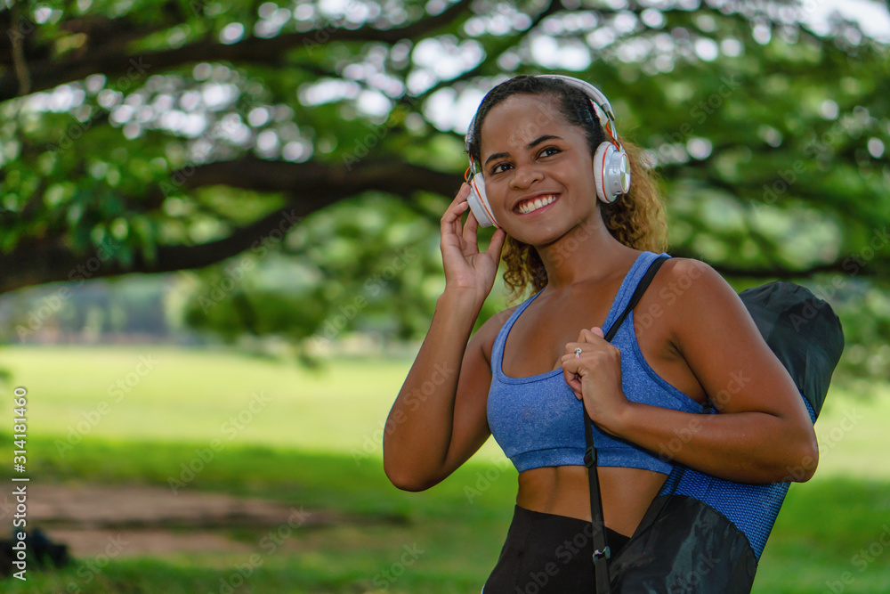portrait of african american woman having workout in park portrait of african american woman having workout in park
