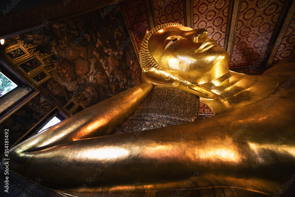 famous golden reclining buddha statue at wat pho bangkok thailand