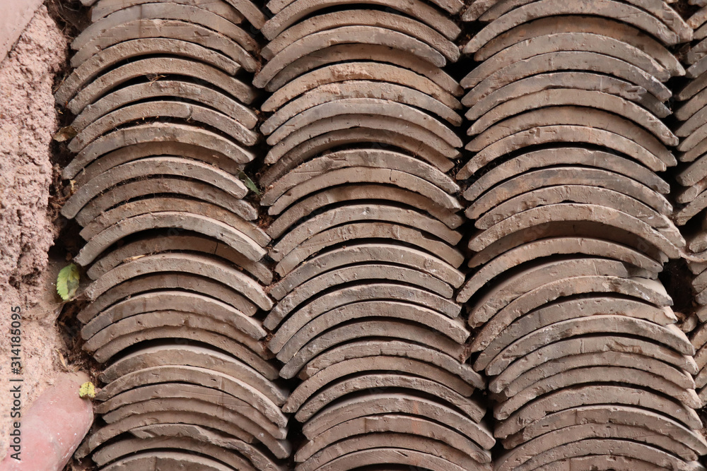 Stack of new roof tile at Tianshui Wushan Water Curtain Caves, Gansu China. Stack of new roof tile at Tianshui Wushan Water Curtain Caves, Gansu China.