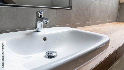 Konstfotografi sink and faucet in modern bathroom