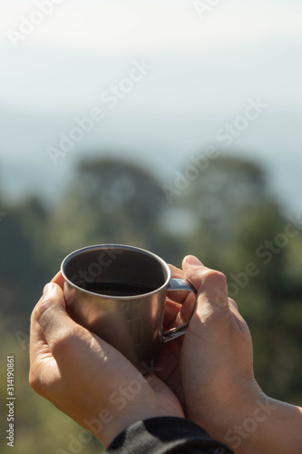 drinking Dripping Coffee at camp with nature photo