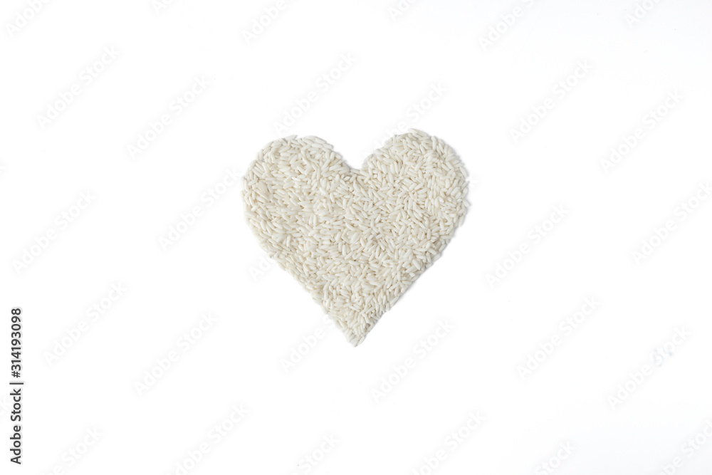 Pile of rice seed in heart shape isolated on white background Pile of rice seed in heart shape isolated on white background