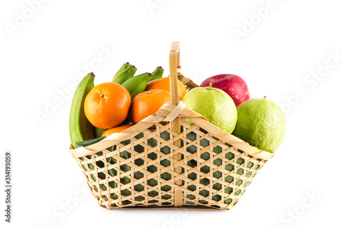 orange  guava  banana and apple in wicker basket on white background fruit health food isolated